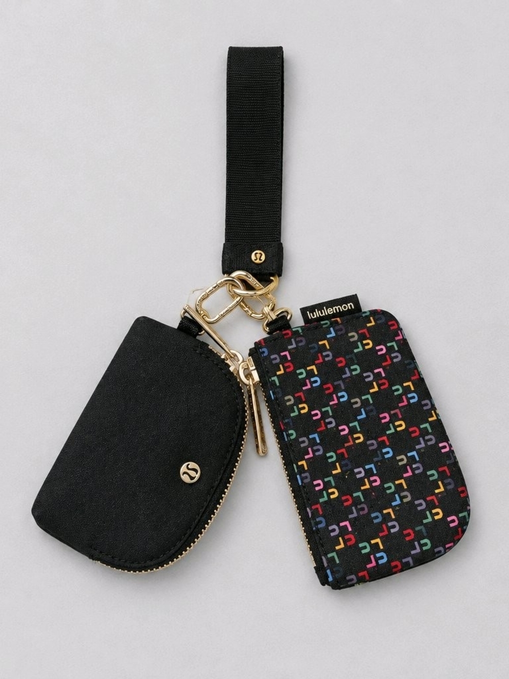 lululemon athletica Black Wristlet with Multicolor Logo Pouch